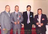 Cristián Marzic (Ernst&Young) y Gabriel Triunfo (Aguas Cordobesas) recibiendo un reconocimiento especial de parte de Enrique Pedemonte (Pte. Ejecutivo del Congreso) y Marco Lorenzatti (Secretario de Educ. Continua UBP).